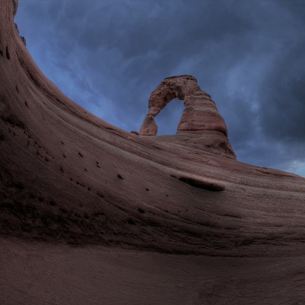 As we hiked up to Delicate Arch at dusk the clouds were threatening and it was obvious there would be no golden light at sunset...