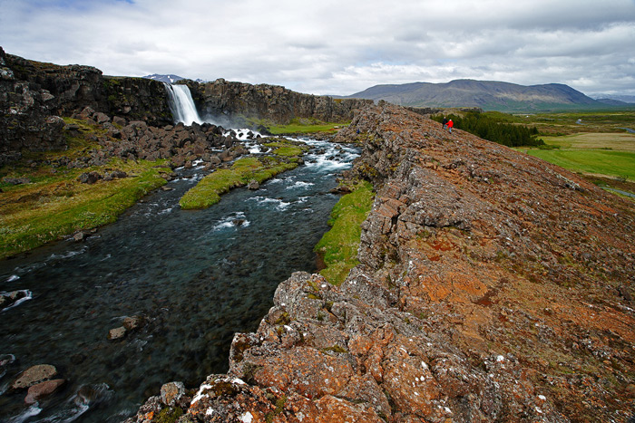 This image shows the North American and European continental plates pulling apart at Pingvellir, Iceland. The European plate...
