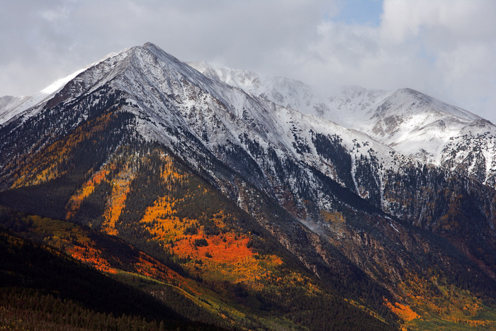 Just as the aspens are starting to turn into their autumn colors an early snow blankets the mountains along Independence Pass...