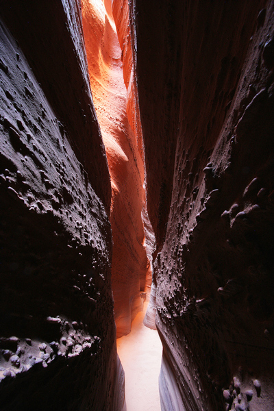 Tight Spot This is one of the tightest slot canyons I've been in. At this point it is probably less than 18 inches wide. We had to take...
